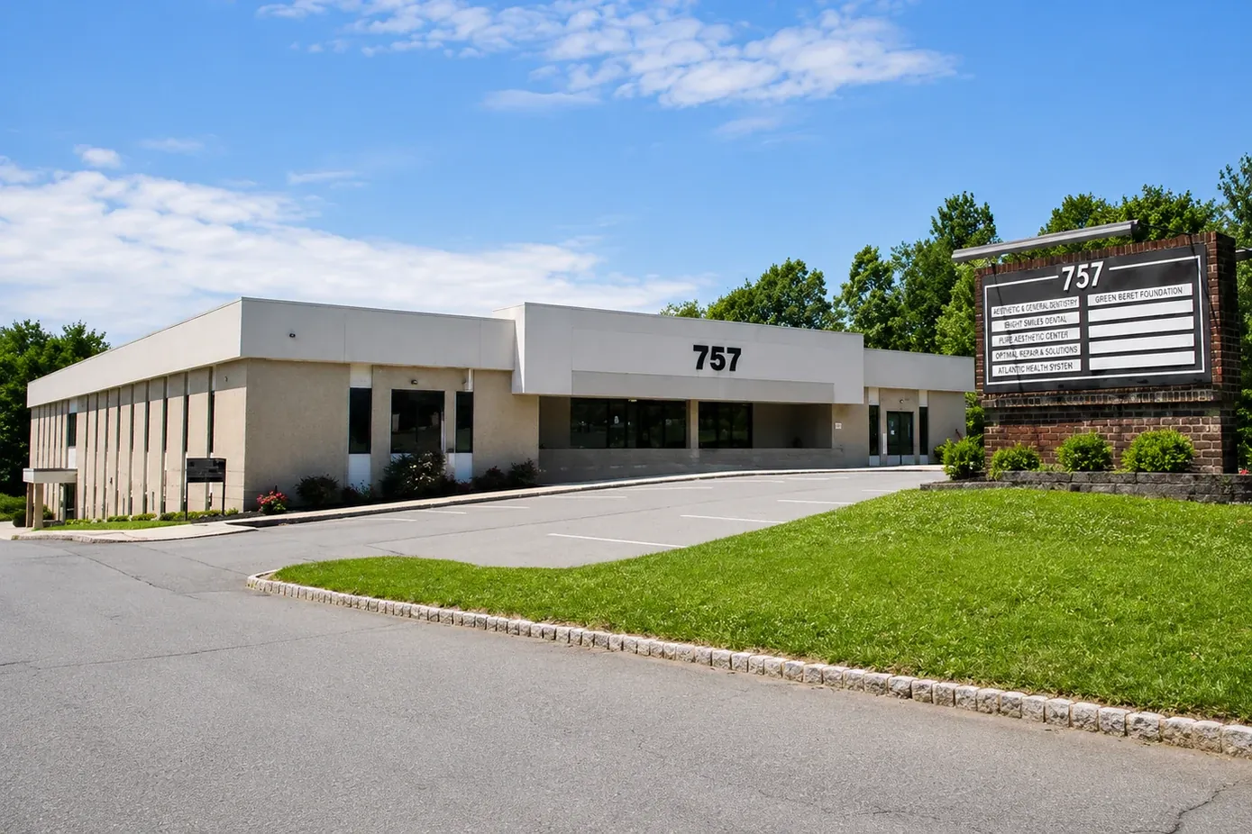 The 757 Route 202 office building in Bridgewater, its sign out front beside the parking lot.