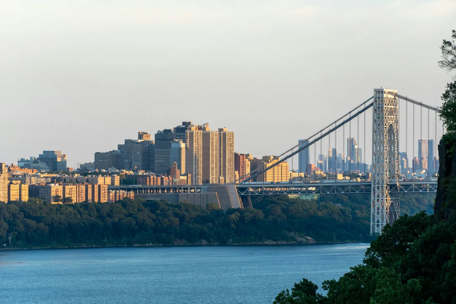The George Washington Bridge spanning the Hudson River beside the Palisades.