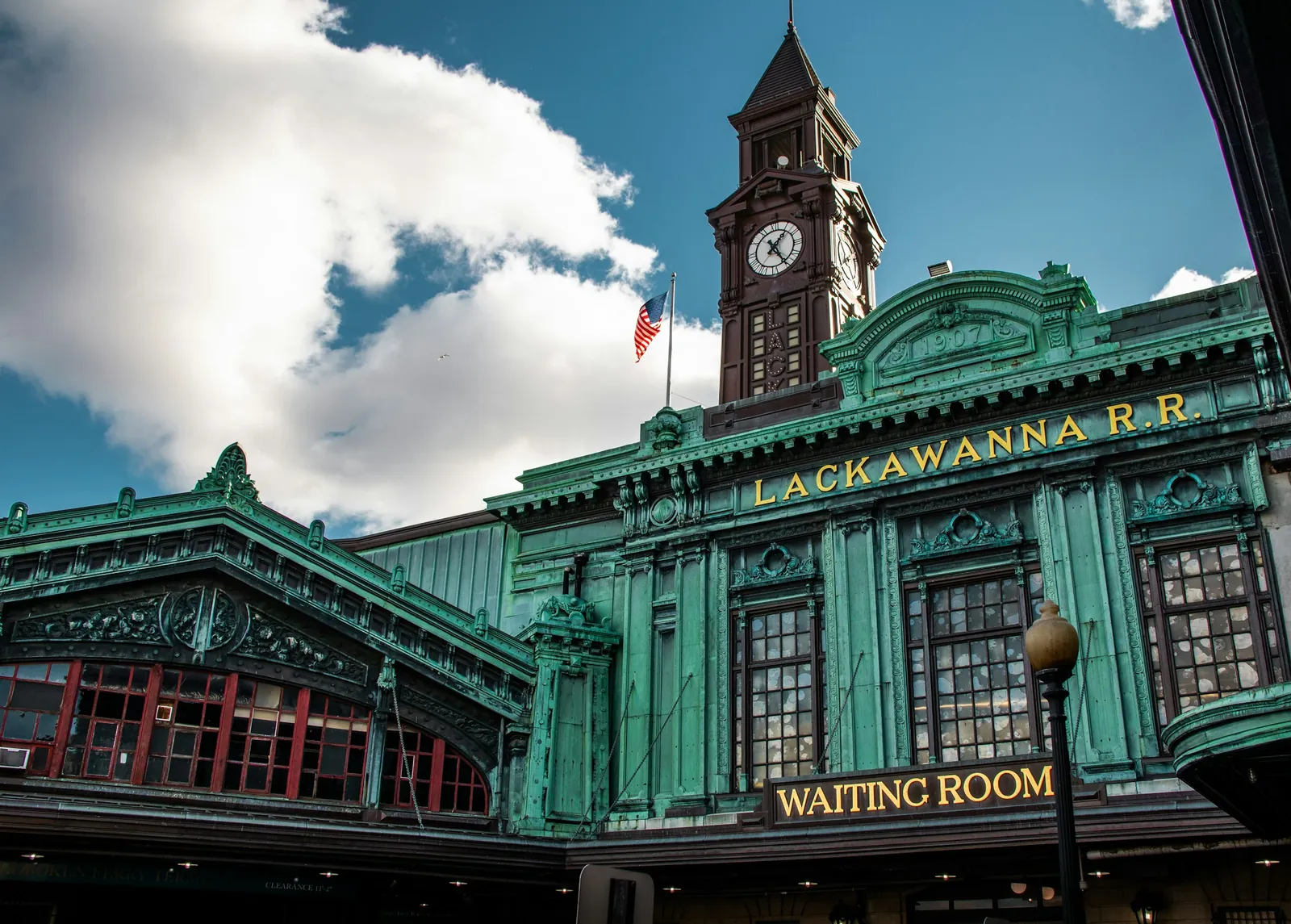 The green copper clock tower of Hoboken Terminal, where PATH trains and ferries arrive.